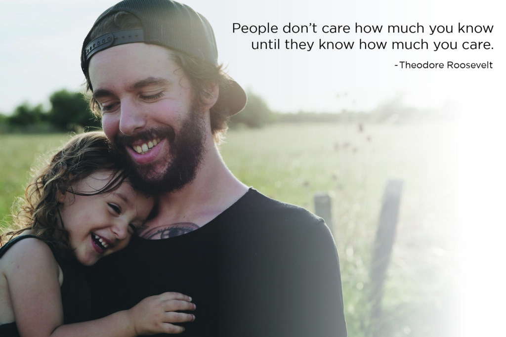 Father and daughter smiling in a field. A quote from Theodore Roosevelt reads, "People don't care how much you know until they know how much you care."