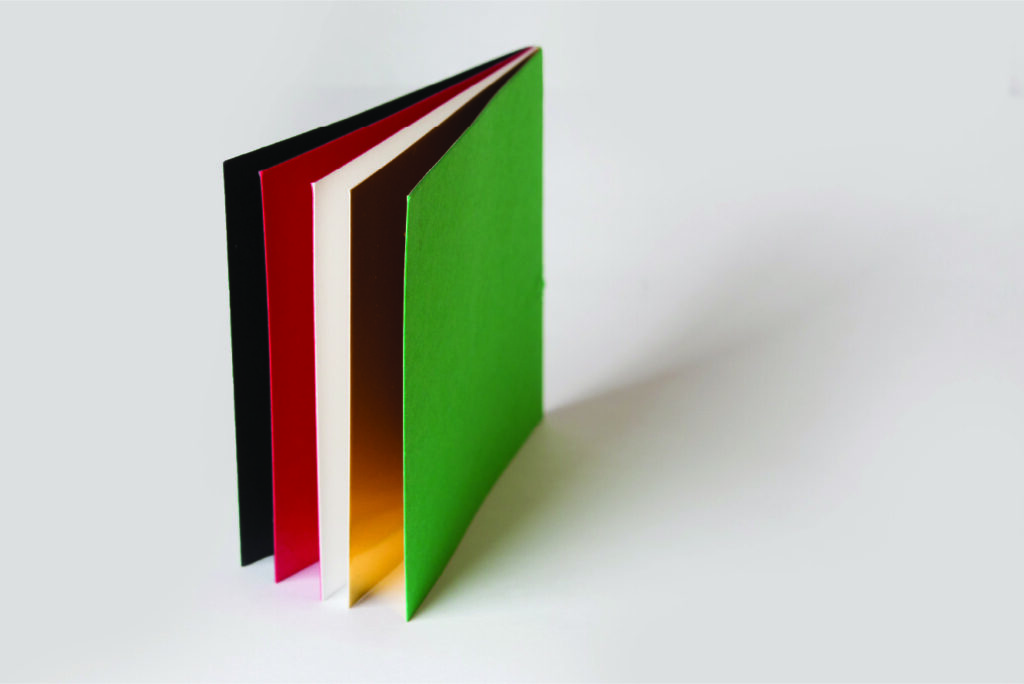 Wordless book, with five pages in five colors. Black, Red, White, Gold, and Green.